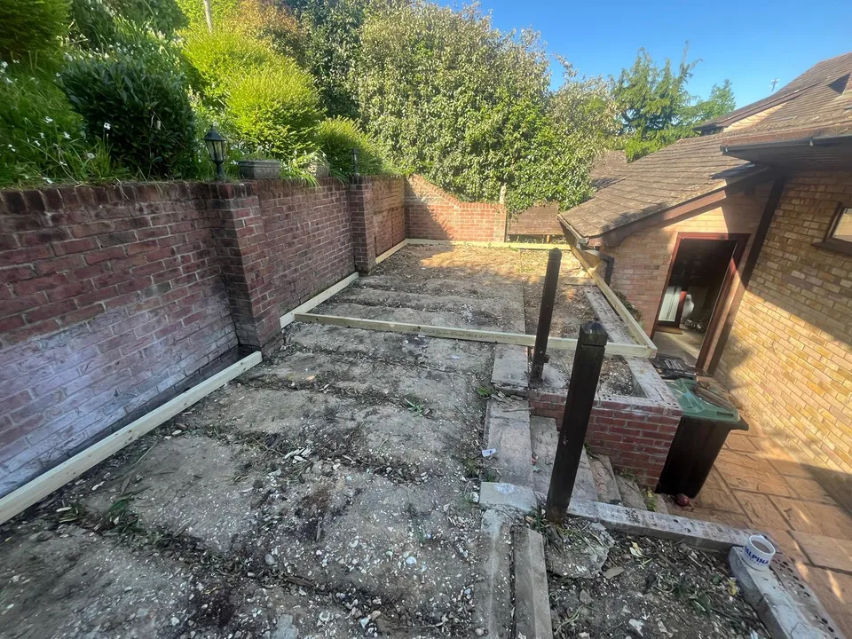 Raised terrace with old concrete paving before the decking was laid